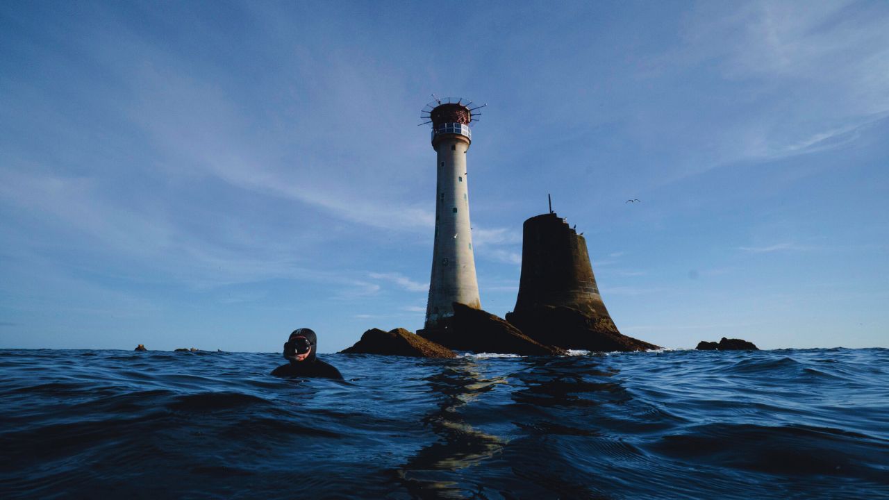 Offshore lighthouse with snorkellers and RIB