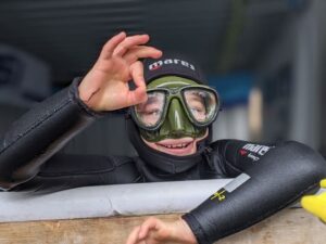 Scuba diver signalling OK from our on-site pool